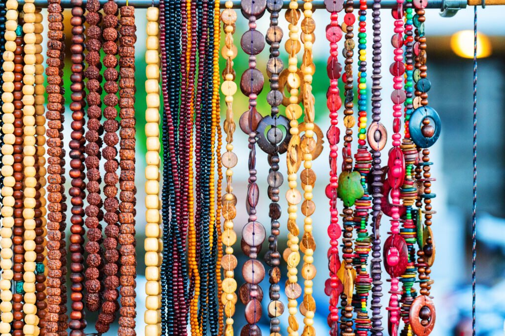 Colourful handmade necklaces and beadwork displayed at a souvenir shop